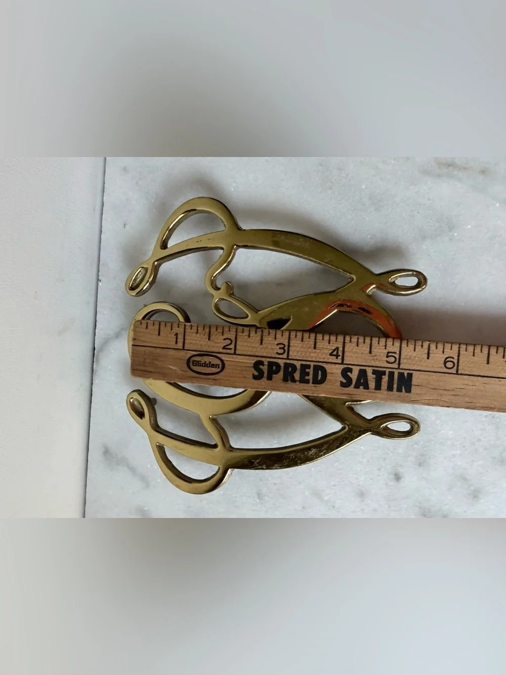 George Washington Cypher solid brass trivet, likely by Virginia Metalcrafters.